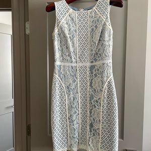 Creamy white lace with blue underlay. Worn once, sz6